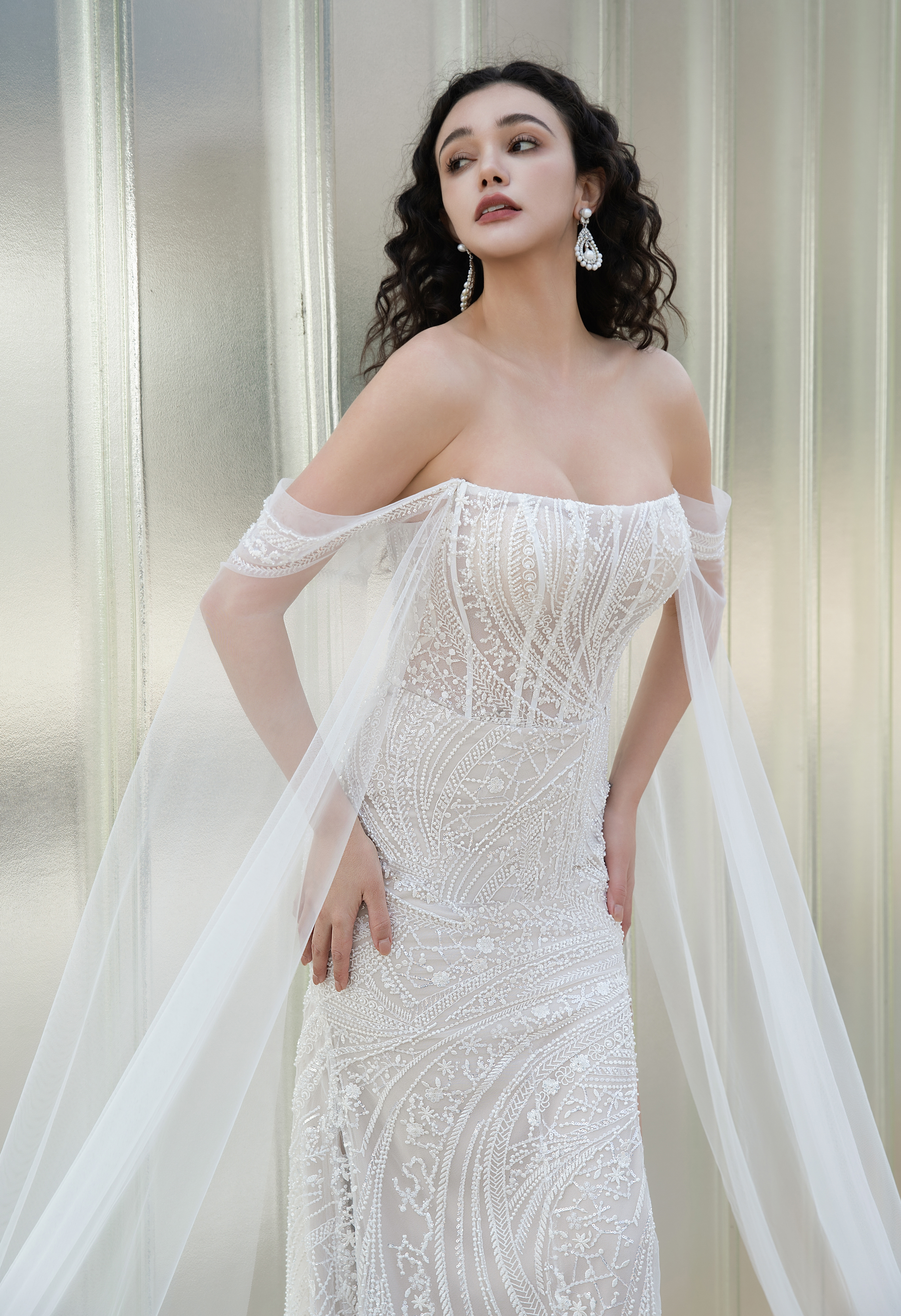 Ethereal Grace: Beaded Off-the-Shoulder Gown with Flowing Tulle Capelet - wedding dress at Lacy Bridal San Antonio