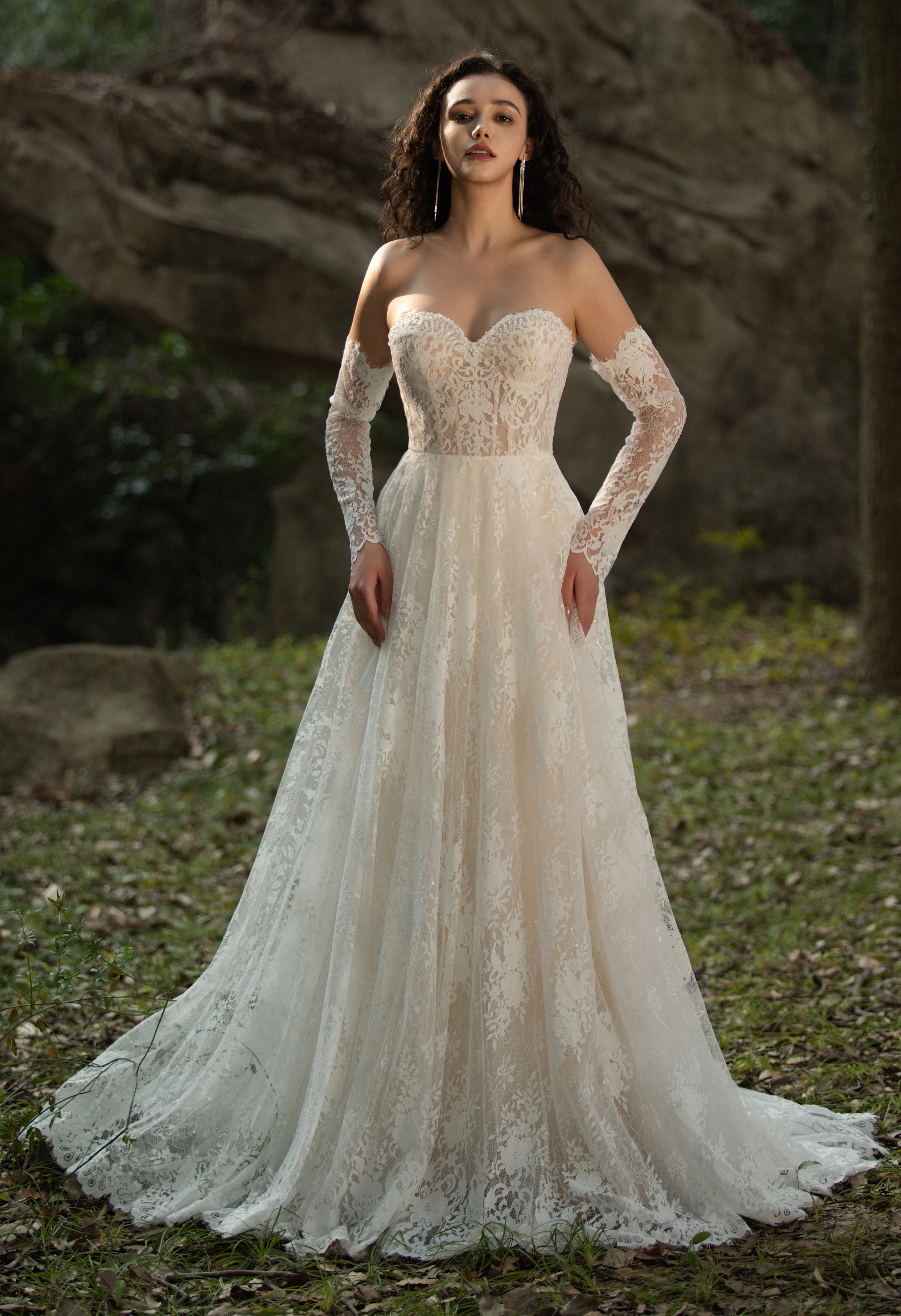 This off-shoulder lace gown brings fairytale romance to life with sheer sleeves and floral detailing. Ideal for vintage-
