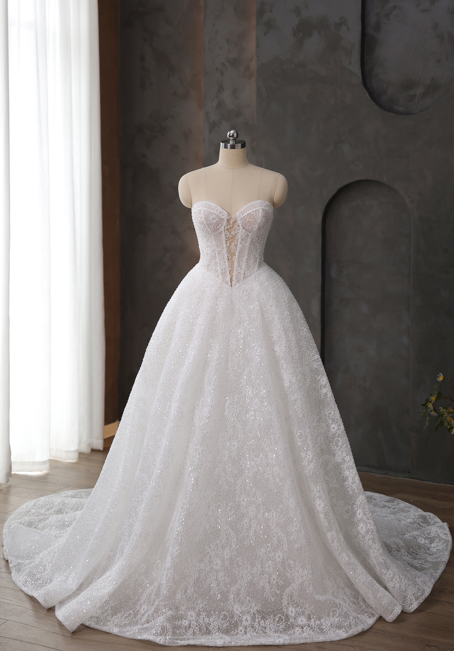 A beaded corset bodice and full shimmering skirt create fairytale magic. Ideal for the glamorous San Antonio bride who l
