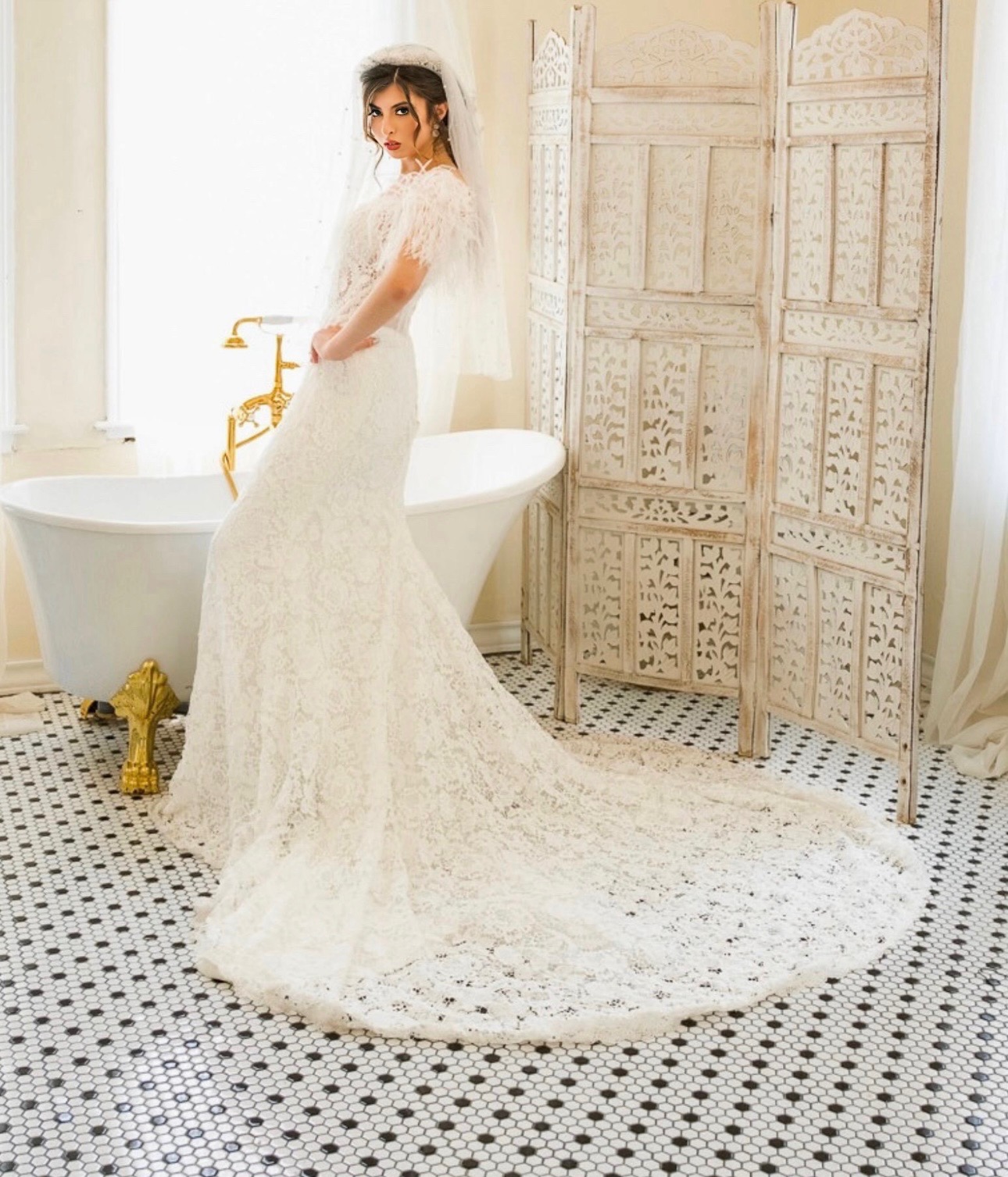 This stunning lace gown combines a fitted silhouette with a delicate, romantic aesthetic. The intricate lace hugs the fi