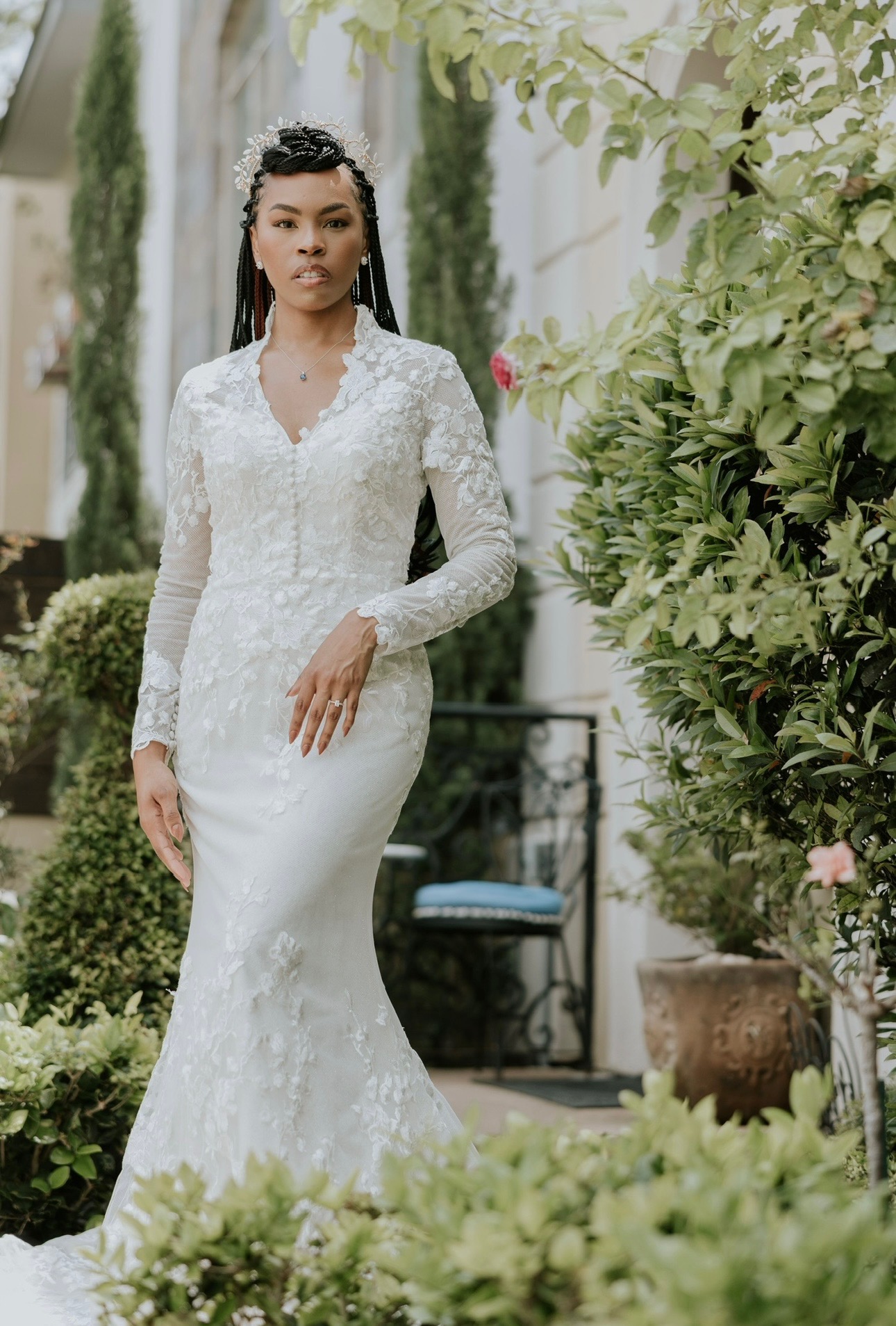 Timeless sophistication meets modern grace in this fitted lace gown featuring long sleeves, a delicate V-neckline, and e