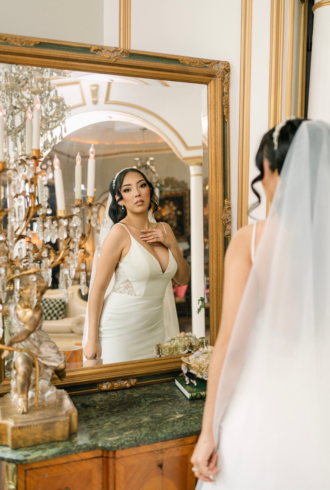 Elegant, modern, and irresistibly sophisticated — this sleek crepe gown features a plunging V-neckline, illusion lace si