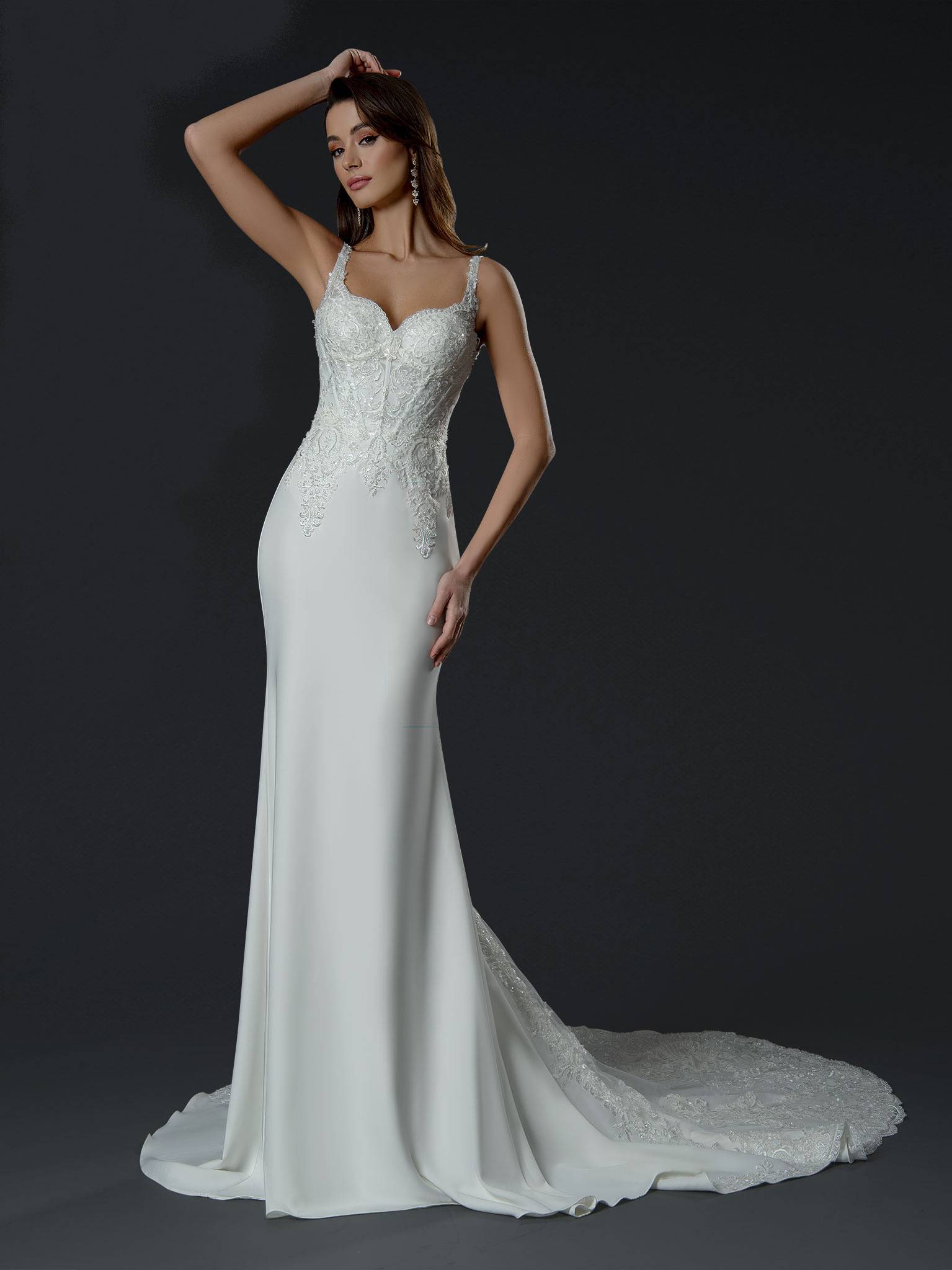 Effortlessly elegant and beautifully fitted, this gown features a delicate lace bodice, sweetheart neckline, and sleek c