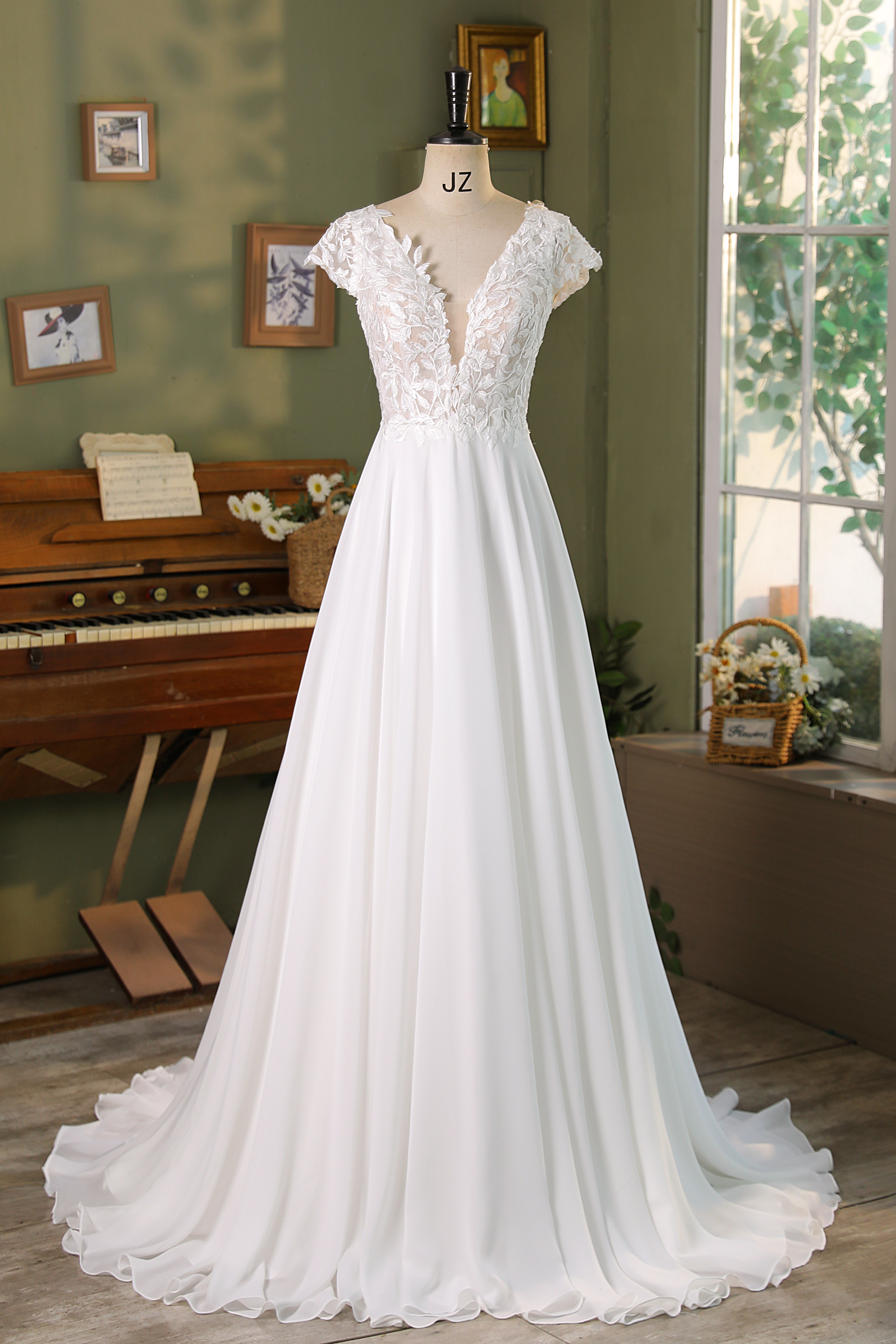 Light, flowy, and full of charm — this chiffon A-line gown features a delicately detailed lace bodice with a soft V-neck