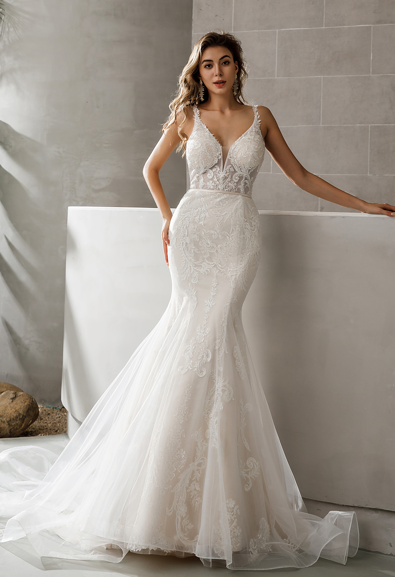 Intricate lace, a sheer bodice, and soft tulle train define this romantic fit-and-flare gown—elegant and captivating. #W