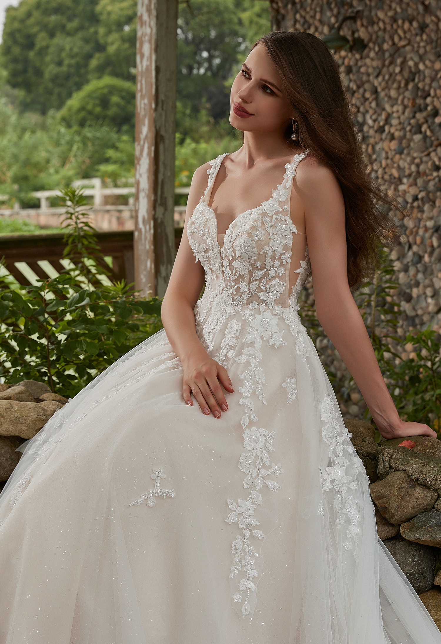 Indulge in the fairytale romance of this romantic A-line wedding dress composed of elegant lace, tulle and floral lace a