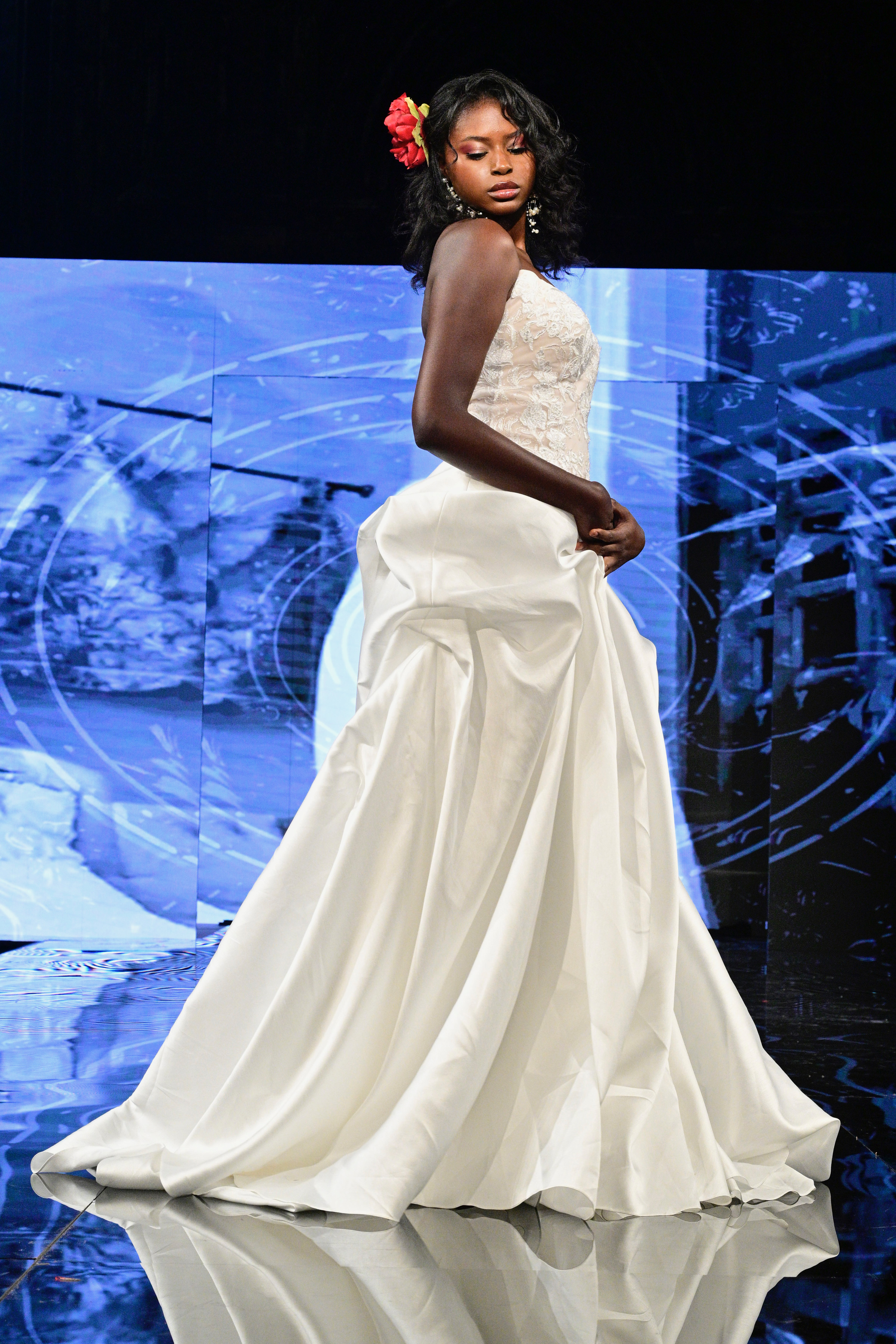 Chic sophistication meets timeless romance in this satin ball gown featuring a structured lace bodice and elegant draped