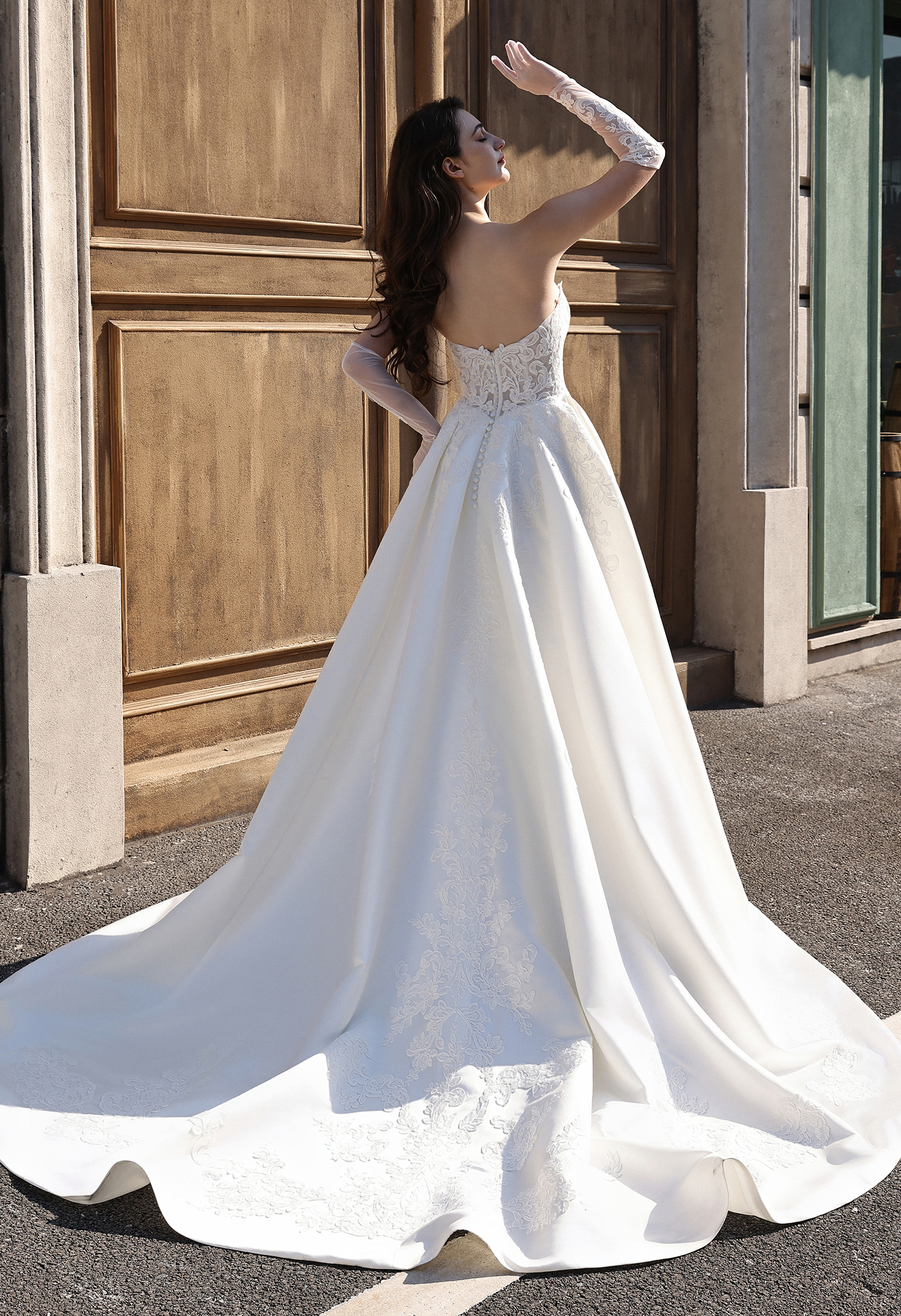 Fall in love with the Celeste wedding dress — a romantic lace corset ball gown featuring a flattering basque waist, swee