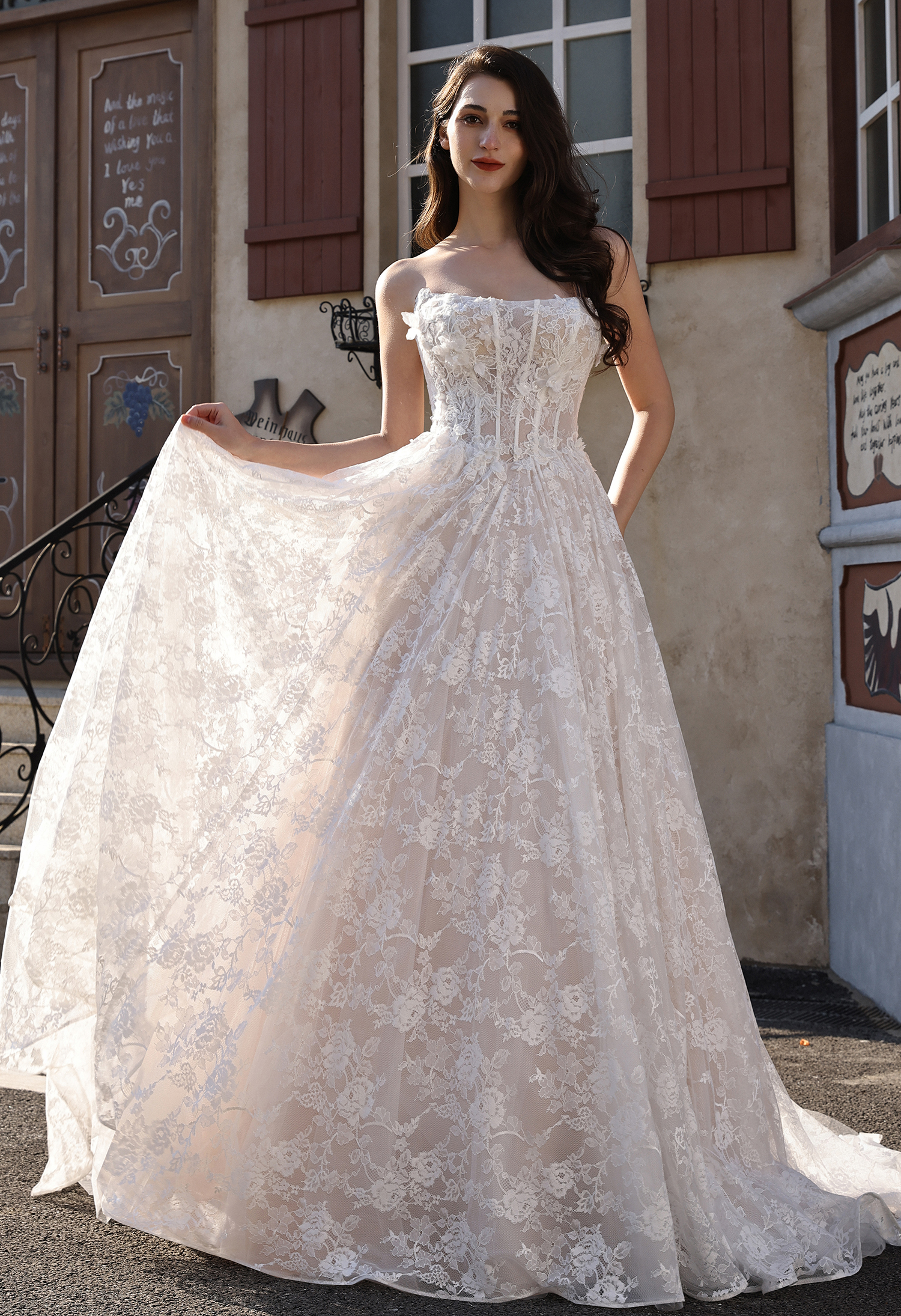 Fall in love with this beauty — a romantic lace corset ball gown featuring a soft cat-eye neckline, sheer illusion bodic