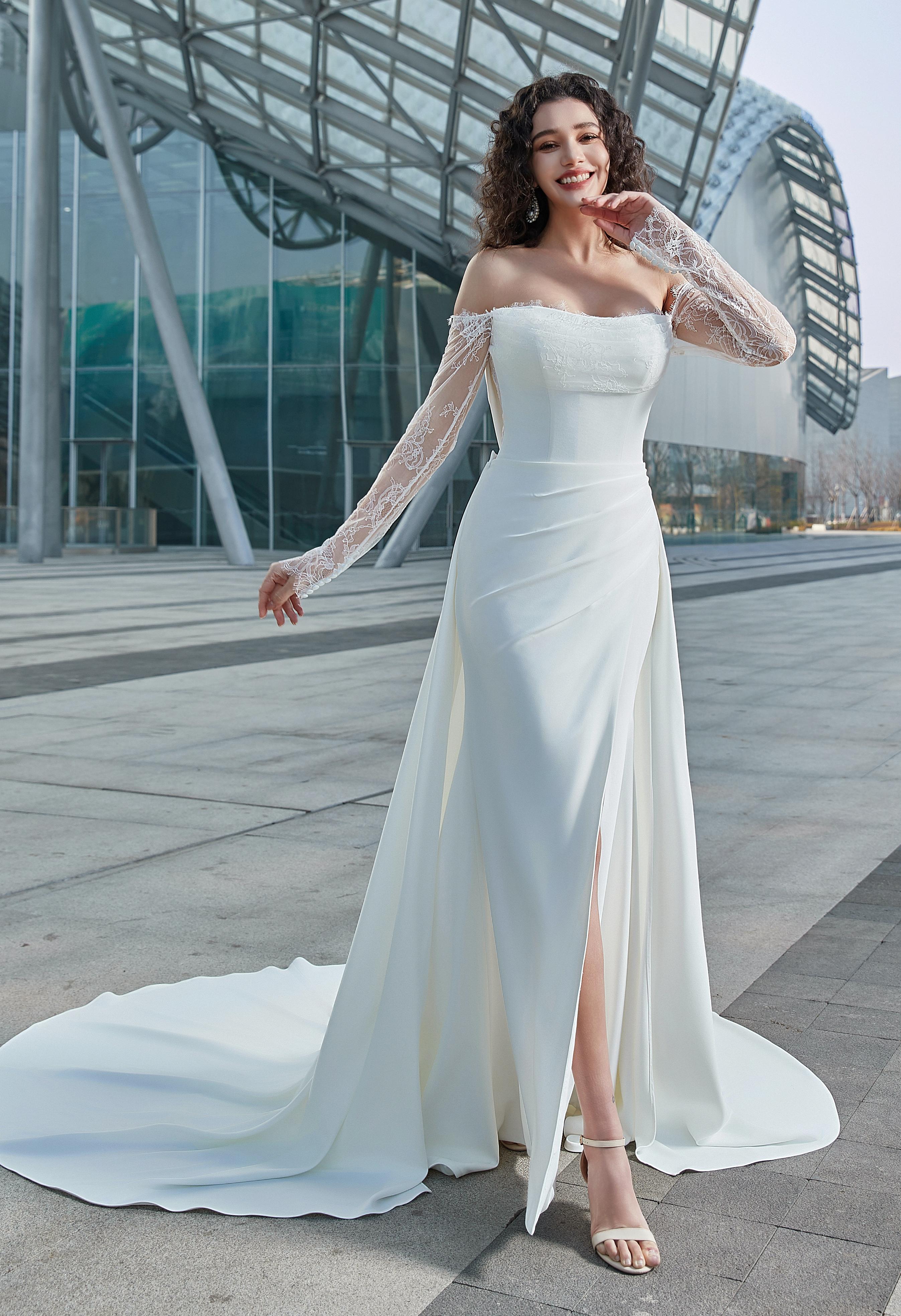 Modern Romance: Sleek Satin Gown with Lace Sleeves & High Slit - wedding dress at Lacy Bridal San Antonio