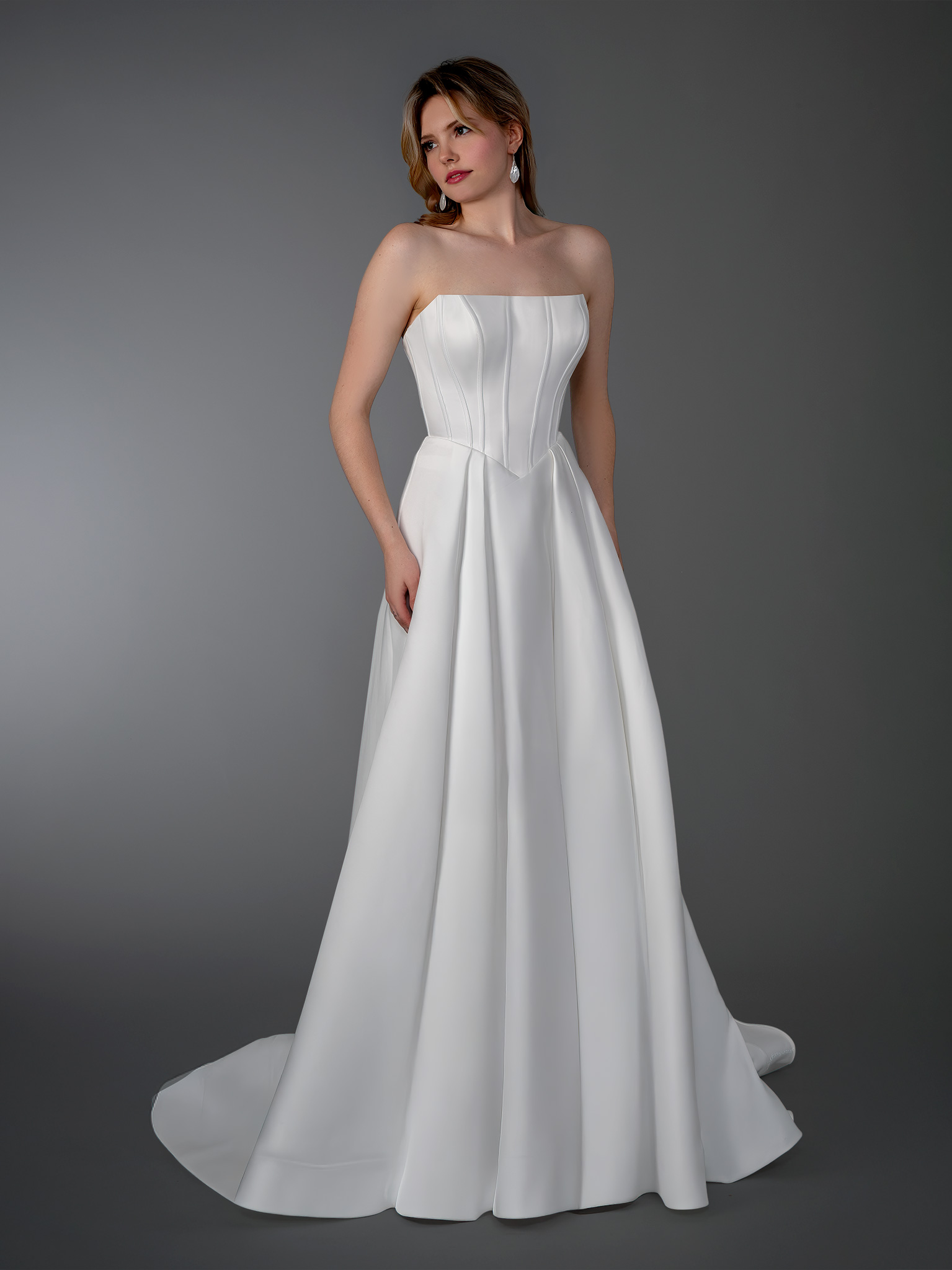 This strapless corset A-line wedding dress is a modern take on timeless bridal elegance. Featuring a structured corset b