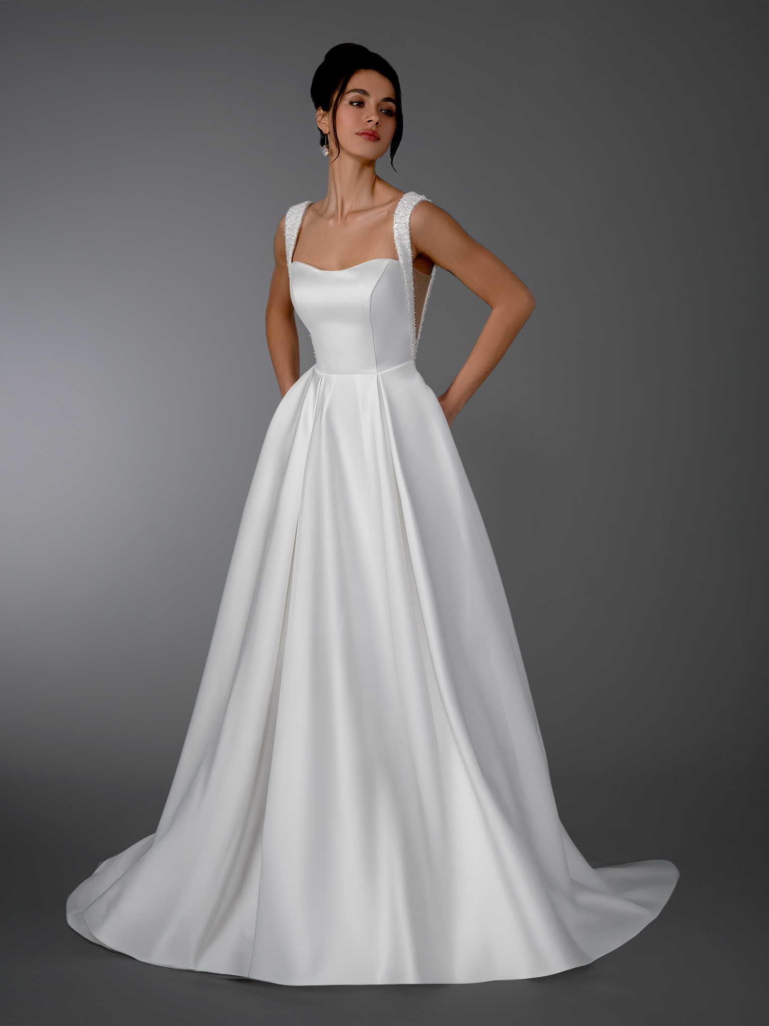 This modern minimalist A-line wedding dress is designed for the bride who loves clean lines, structure, and timeless ele